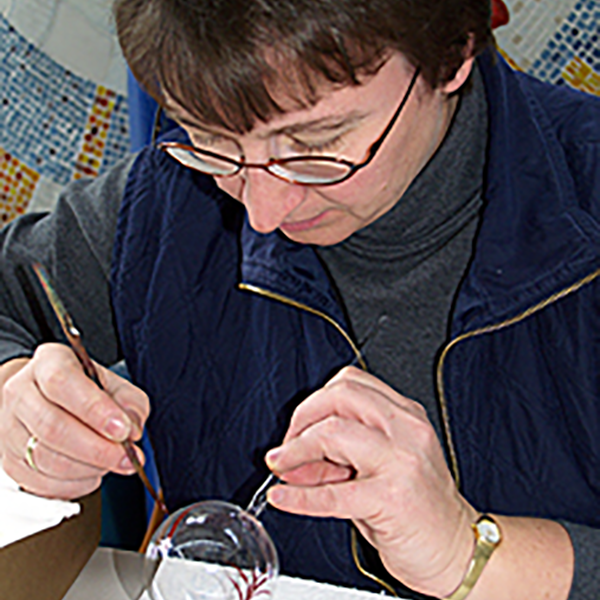 Painting a christmas tree ornament | Glavena Glavena owner painting christmas tree ornament